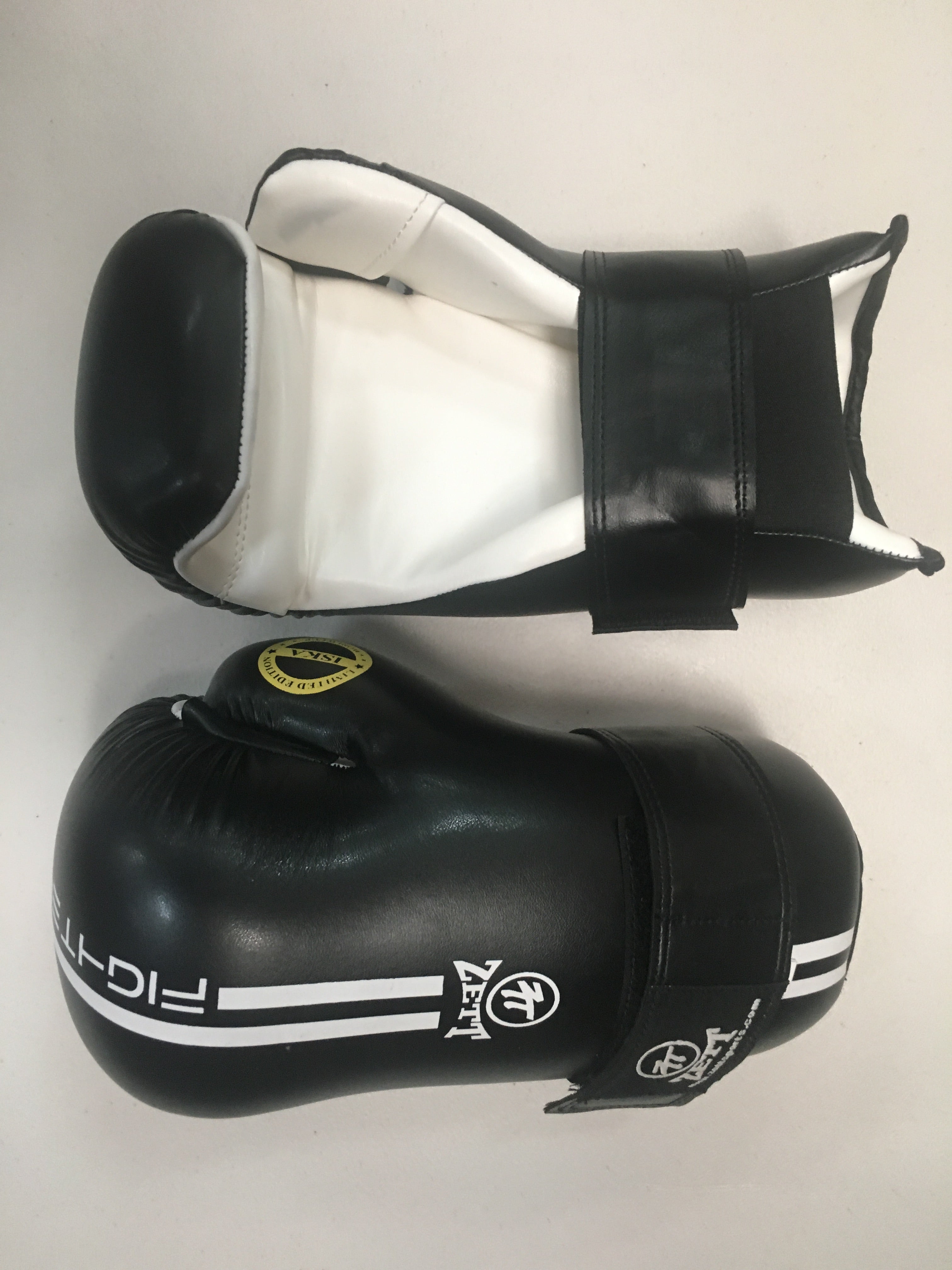 Zett ISKA sparring gloves in green, side view